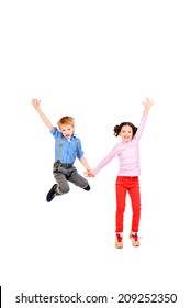Happy little girl and boy jumping for joy together. Children. Isolated over white. - Shutterstock ID 209252350
