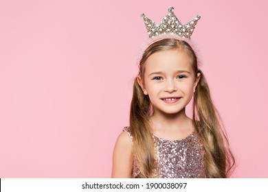 Happy Little Girl In Crown Smiling Isolated On Pink