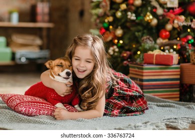 Happy Little Girl And Dog At Christmas