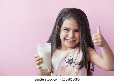 Happy Little Girl Drinking Yogurt. 