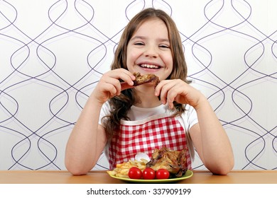 Happy Little Girl Eating Chicken Wings 