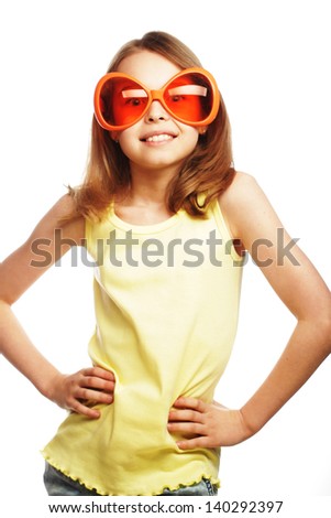 happy little girl with fun orange carnaval glasses