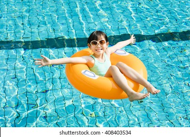 happy little girl having fun  in swimming pool