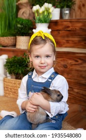 Happy Little Girl Hug Bunny. Smilling Small Girl With Rabbit. Child Playing With Pet Bunny. Kid Play With Animal. Child At Easter Egg Hunt. Kid Take Care Of Pet. Concept Love Pet Animals. Easter Bunny