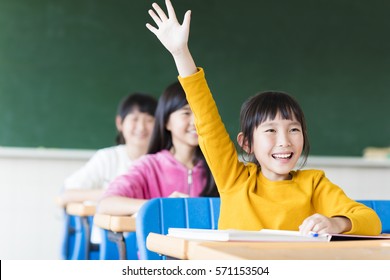 happy little girl learning in the classroom