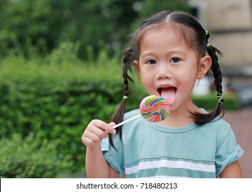 Close Little Girl Licking Lollipop Candy Stock Photo (Edit Now) 719155177