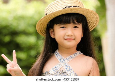 Happy little girl on outdoor playground