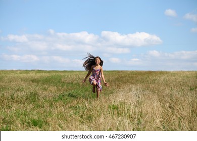 Happy Little Girl Running In Summer Field