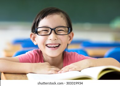 happy little girl studying in the classroom 