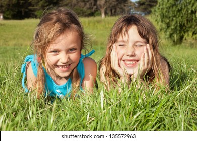 Happy Little Girls Lying On Grass Stock Photo 135572963 | Shutterstock