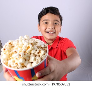  Happy Little Indian Boy Eating Popcorn 