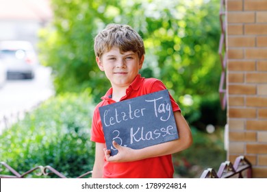 Happy Little Kid Boy With Backpack Or Satchel And Glasses. Schoolkid On The Way To School. Healthy Adorable Child Outdoors On Desk Last Day Third Grade In German. School's Out