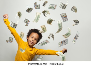 Happy Little Kid Standing Under Money Rain Isolated On White Background