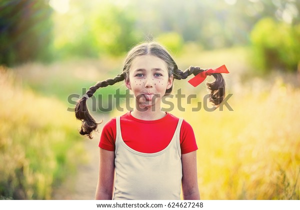 Happy Little Naughty Girl Pigtails Summer Stock Pho