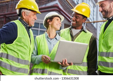 Happy Logistics Worker Team With Laptop PC In Front Of The Logistics Center