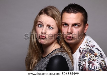 Similar – Young couple posing with funny faces