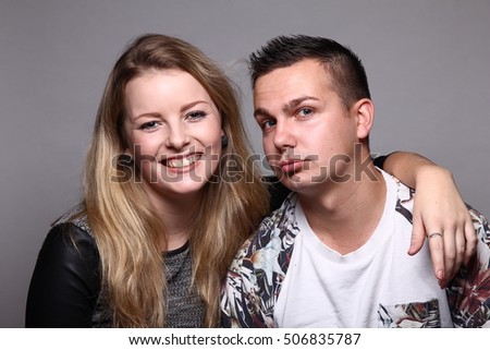 Similar – Young couple posing with funny faces