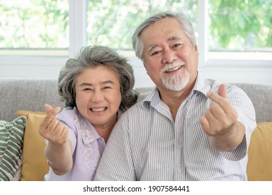 Happy Love Elderly Couple Smile Face , Senior Couple Old Man And Senior Woman Relaxing Show Heart Sign In Their Home