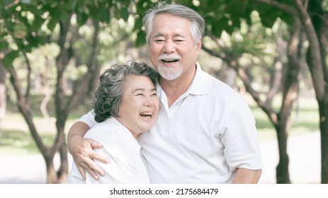 Happy Love Elderly Couple Smile Face , Senior Couple Old Man And Senior Woman Relaxing Hug In A Forest