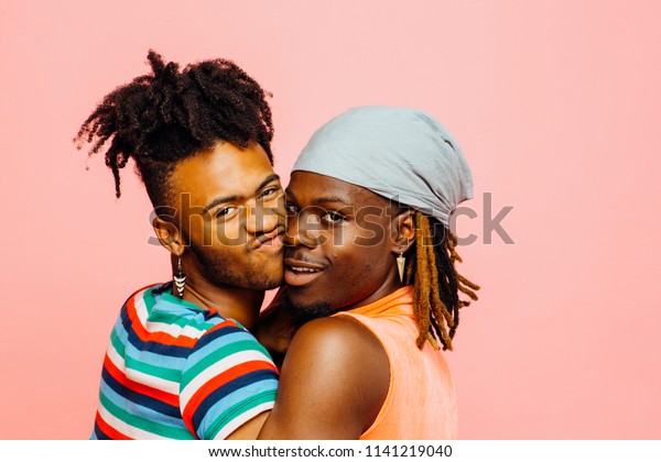 two black gay men kissing