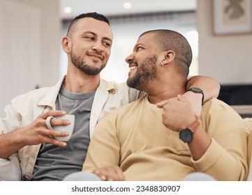 Happy, love and gay couple relaxing on a sofa with a cup of coffee in the living room together. Smile, bonding and young lgbtq men with a latte sitting in the living room of their modern apartment. - Powered by Shutterstock