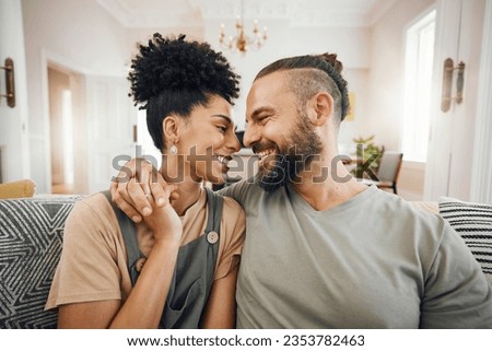Happy, love or interracial couple on a sofa, care or commitment with relationship, weekend break or loving together. Home, man or woman on a couch, marriage or romantic with bonding, date or relax