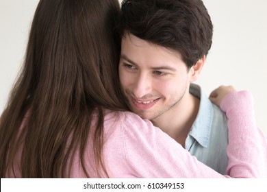 Happy Loving Boyfriend Embraces Girlfriend Indoors, Teenage Couple In Love Hugging, Woman Hugs Young Handsome Man As A Gesture Of Thanks, Guy Looking Away And Feeling Shy, Wife Congratulating Husband 