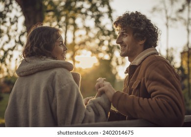 Happy loving couple enjoying their time together in park. - Powered by Shutterstock