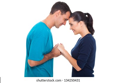 Happy Loving Couple Holding Hands Over White Background