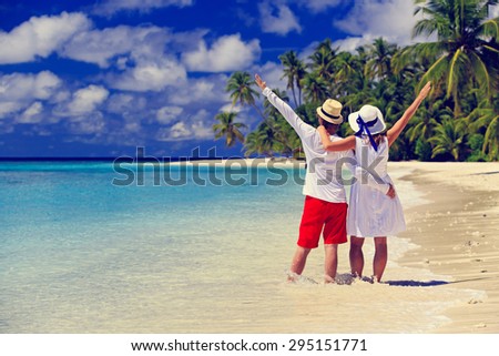 happy loving couple on summer tropical beach