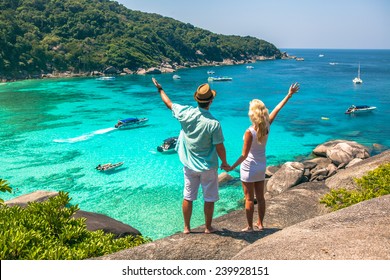 Happy Loving Couple On A Tropical Beach Against The Sea Similan Island