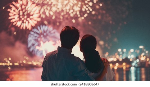 Happy loving couple watching fireworks. - Powered by Shutterstock