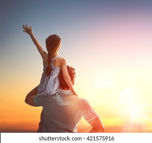 Happy Loving Family. Father And His Daughter Child Girl Playing And Hugging Outdoors. Cute Little Girl And Daddy. Concept Of Father's Day.