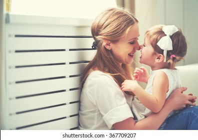 Happy loving family. mother and child girl playing, kissing and hugging - Shutterstock ID 367709207