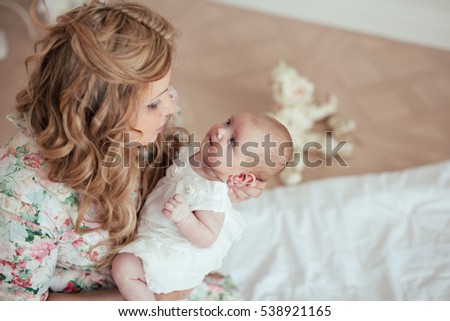Similar – Image, Stock Photo happy mother and 9 month old baby in matching pajamas