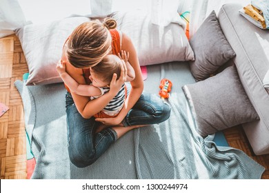 Happy Loving Family. Mother And Her Child Baby Boy Playing In The Summer Day. Mother And Child Boy Play Together Indoors At Home. Happy Young Mom Holds Little Child And Gently Hugging His Little Body