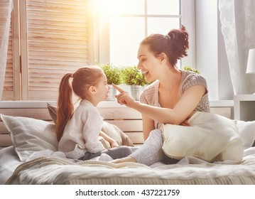 Happy Loving Family. Mother And Her Daughter Child Girl Playing Together.