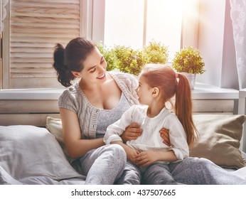 Happy loving family. Mother and her daughter child girl playing and hugging. - Shutterstock ID 437507665