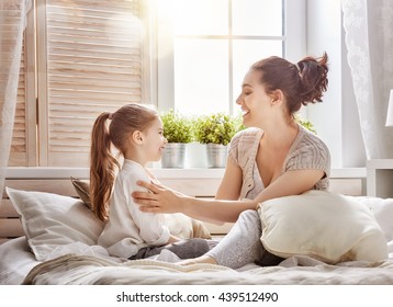 Happy loving family. Mother and her daughter child girl playing together. - Shutterstock ID 439512490