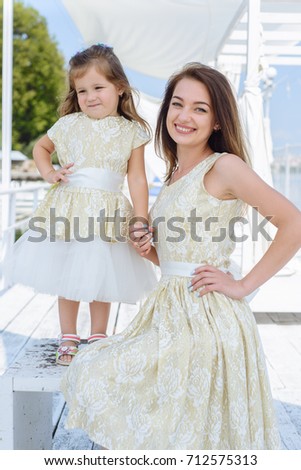 Happy loving family. mother with her daughter in a white light dress