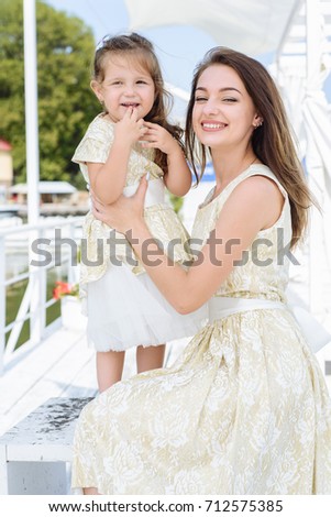 Happy loving family. mother with her daughter in a white light dress