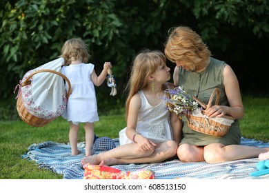 Happy loving family. The mother and two daughters - Shutterstock ID 608513150