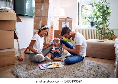 Happy Loving Family In New Home.
