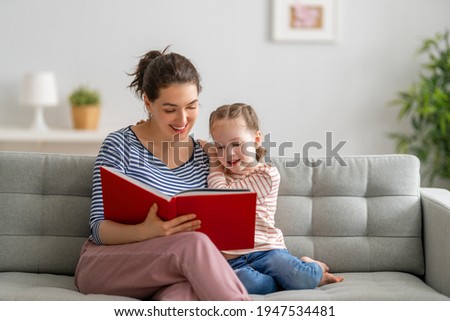Similar – Image, Stock Photo Happy little girl reading and relaxing lying over sleeping mat in a cozy tent at home