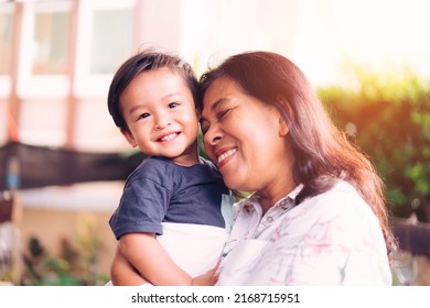 Happy Loving Family.Indian Grandmother And Grandson Are Having A Good Time Together And Playing Hug And Kiss Her Grandson Outdoor. Asian Boy Kid Smiling Laughing With His Mother.Kid Boy Child.brazil.