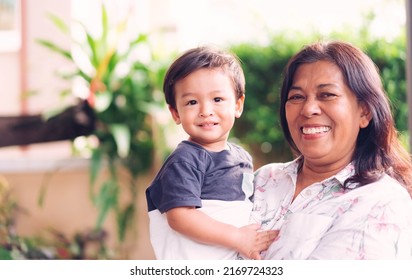 Happy Loving Family.Indian Grandmother And Grandson Are Having A Good Time Together And Playing Hug And Kiss Her Grandson Outdoor. Asian Boy Kid Smiling Laughing With His Mother.Kid Boy Child.brazil.