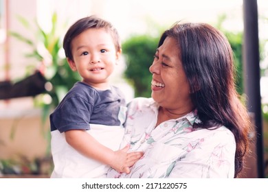 Happy Loving Family.Indian Grandmother And Grandson Are Having A Good Time Together And Playing Hug And Kiss Her Grandson Outdoor. Asian Boy Kid Smiling Laughing With His Mother.Kid Boy Child.brazil.