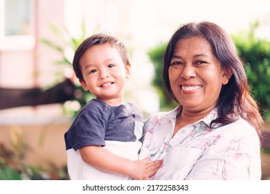 Happy Loving Family.Indian Grandmother And Grandson Are Having A Good Time Together And Playing Hug And Kiss Her Grandson Outdoor. Asian Boy Kid Smiling Laughing With His Mother.Kid Boy Child.brazil.