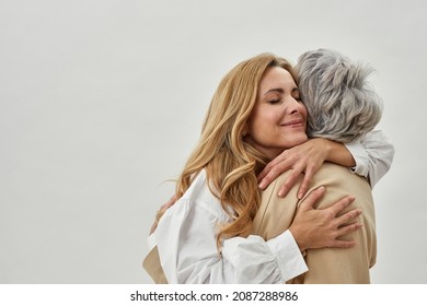 Happy loving young grownup daughter embrace mature mom show care and gratitude. Smiling adult woman child hug senior mother feel thankful grateful. Motherhood, family unity concept. - Shutterstock ID 2087288986