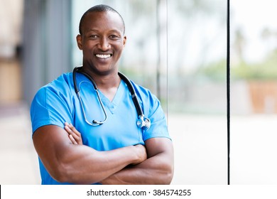 happy male african medical surgeon looking at the camera